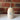 Cowrie shell oil pourer