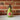 Red and green hibiscus oil pourer